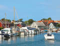 Former wooden fishermen's houses line the harbour of Viken
