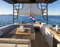 Biminis and carbon poles are ordered separately. Teak steps lead up to the T-top on both sides