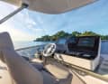 The helm station on the flybridge is fully equipped with electronics