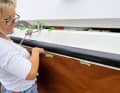 Fixing: Again using normal adhesive tape, the film is then brought into its final installation position and fixed in place. This process requires a lot of experience and dexterity