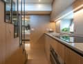 The galley acts as a "room divider" between the owner's suite installed amidships and the VIP cabin in the bow.