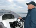 The boat has a sports steering wheel with hydraulic steering
