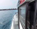 The pull-out tubular frame on the cabin roof is the bimini holder