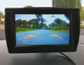 This is how the image reaches the driver. The colour markings help to correctly estimate distances
