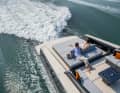 An electronically steerable bathing platform including garage awaits at the stern