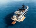 At anchor, the aft bulwarks can be folded down and used as a beach club.  An Opacmare Transformer acts as a bathing ladder.