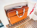 Practical document pocket under the driver's platform