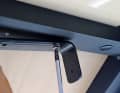 Once the installation location has been determined, mark out the necessary holes, pre-drill 3 mm holes and then attach the mounting bracket to the ceiling. In our case, we used 4 mm self-tapping screws, which are held firmly in the metal frame of the roof of the mobile stand