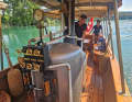 Thomas and Mimi Schmid on their historic steamboat. She steers, he heats