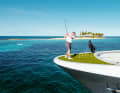 Wide field: "Gene Machines" First Engineer tries to hit the green in the blue in the Bahamas.  If the ball lands in the liquid bunker, it dissolves and becomes fish food