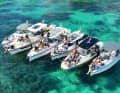 The training fleet of Nimbus and Axopar boats at anchor