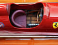 The boat with the shipyard emblem at the back and the Scuderia Ferrari rising horse at the front