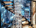 Staircase tam-tam: the owner wanted glamour and the sea. Jellyfish glow on PVC panels, metal rings shine in the open cylinder