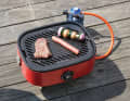 The grill is large enough to barbecue with a crew of four