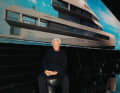 Giorgio Armani in front of his work.