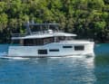 The flybridge yacht from the side.