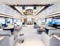 Lots of white, a little petrol: the owner likes it bright and sociable. The saloon is dominated by a lavish lounge and TV area, with twelve guests seated at the dining table in front of it