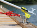 The line is kept under tension and the boat hook is pushed out forwards