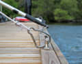 The carabiner clip closes when the boat hook is pulled back