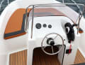 OceanBay 450: The driver sits on the back seat, but still has a high coaming between him and the engine. The control panel is protected and offers plenty of space for additional instruments