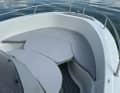 Convertible bow seating area with fixed cushions