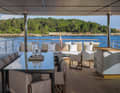 There is a table for ten guests on the upper deck aft.