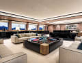 Segmented main saloon: lounge and dining area separated by a sideboard. Vafiadis was keen to create "intimate areas" so that charter guests can withdraw