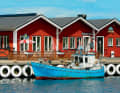 On the Swedish island of Hanö, the tyre fenders on the pier have been chicly painted.