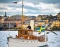 The "Alba II" demonstrates its maritime heritage with an oversized Swedish flag