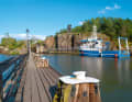 Over the mountain: A trawler approaches the upper lock at Trollhättan on its way to Lake Vänern. The historic lock staircase from 1844 can be seen on the left - with distinctly small chambers