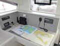 The VHF device, the radio and the WLAN router are located on the sat nav table.