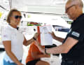 Successful handover with the documents for the charter boat.