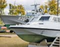 Exhibits on the museum grounds. In the background the KTS "Libelle", in front the border security boat GSB 075