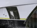 A loud bang, and then the champagne splashes. The glass couldn't withstand the steel hull.