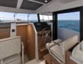 A door leads from the driving position onto the deck