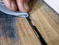 If the air pockets only become apparent later or during final sanding, this is also not a problem. After sanding with 120 grit, the imperfection can also be filled afterwards