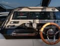 The leather-covered steering wheel is reminiscent of a sports car.