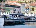 Modern boats against a picturesque backdrop in Cannes. Photographer: Cyril CHARPIN