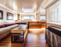 Owner's cabin: Hull windows, light-coloured walls and a Braque painting disguise the ceiling height