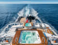 Water cascade: The upper spa pool belongs to the owner's cabin on the bridge deck. Below, it bubbles within sight of the tenders and dining table.