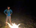 Campfire on the ghetto beach. The night covers the creepy backdrop.