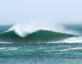 The high swell rolling in breaks at a local shallow area to the A-frame. This wave is too big for beginners. Experts use the left and right side of the wave shoulder - timing and experience are required!