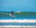 If the wave thrust is not so strong, take a step forwards and paddle on (Fig. 2).