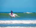 As soon as you realise that you are gliding off the wave (take-off), quickly jump into the surf stance. This requires some practice.