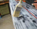 4. second layer of resin: Using a brush, apply a fine layer of resin to the first piece of glass fibre until the resin has been absorbed in all areas.