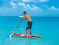 The legs are half bent and the abdominal muscles are tensed in preparation for the twist.