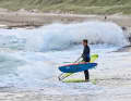 Position yourself close to the water and wait for the aforementioned set breaks. When the last set wave breaks and it looks a little calmer behind it, you need to move quickly:
