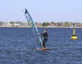 Let your board continue to turn until it is directly upwind, it will now stop. To make it easier for you to fall off, pull the sail slightly over the tail,...