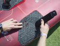 If you're not going full throttle over the water with camber sails, choose a board that also offers inwardly offset plugs.