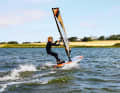 Priceless: The first sense of achievement as a windsurfer. With the right wetsuit, getting started is twice as much fun for children